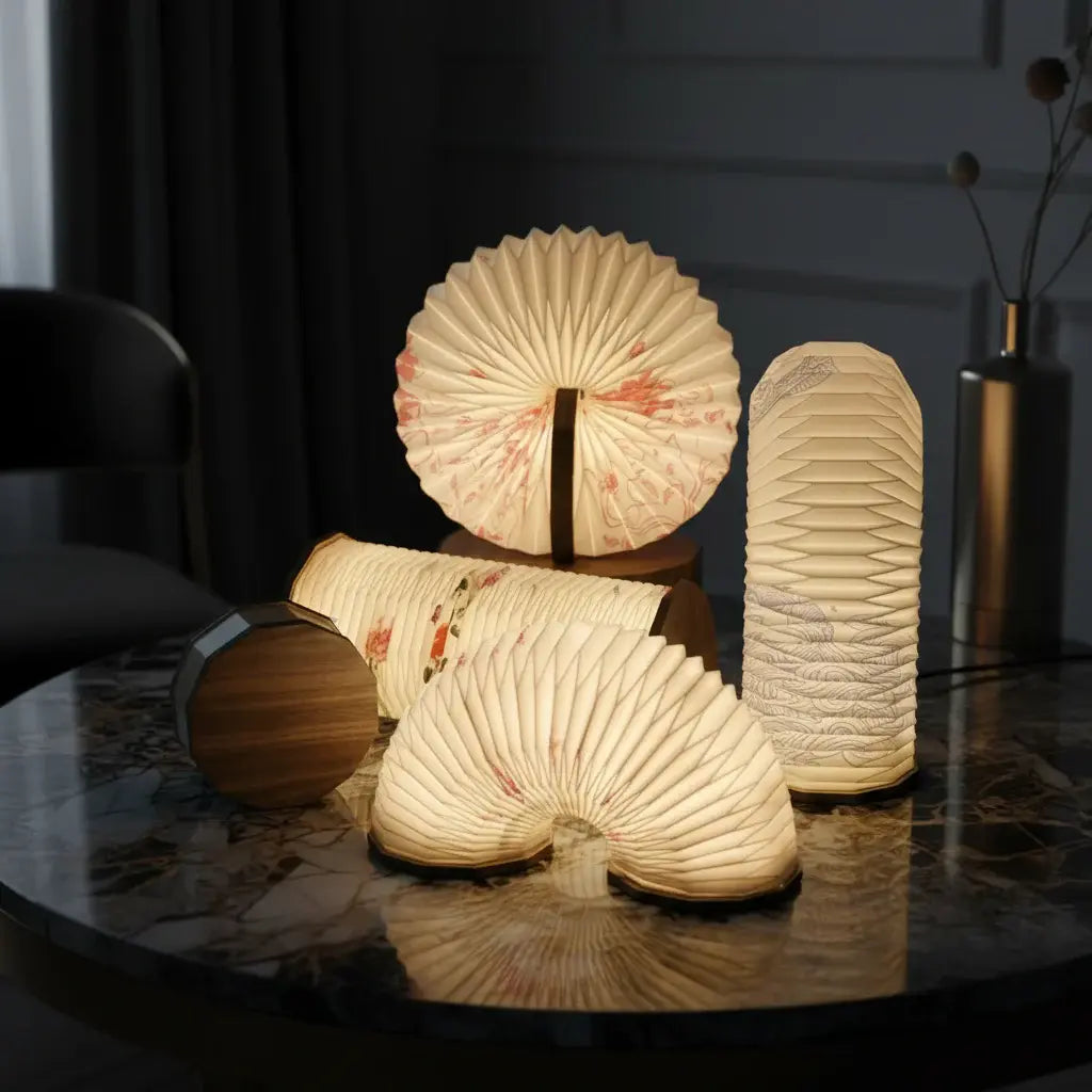 Artistic foldable accordion lamps glowing on a marble table, warm ambient lighting, home decor