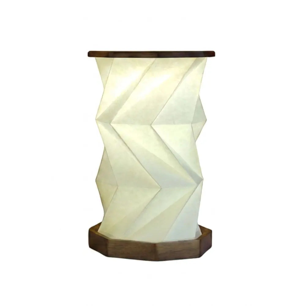 Walnut wood foldable geometric origami lamp with white paper shade, warm glowing LED light